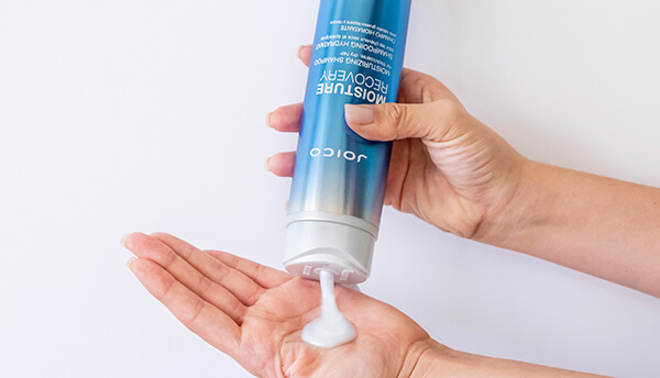Joico shampoo being poured into hand