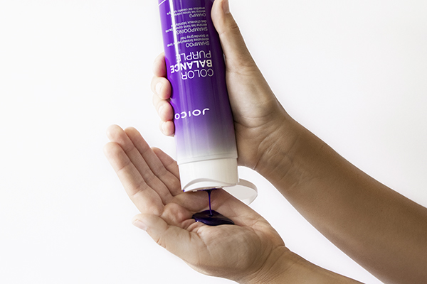 Joico Color Balance Purple Shampoo in hand