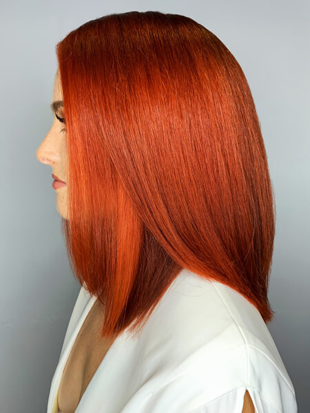 Model with freshly colored vibrant red hair
