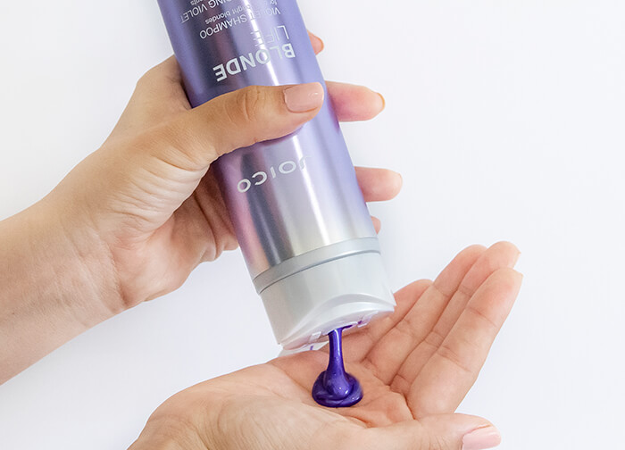 Blonde Life Violet Shampoo pouring into hand