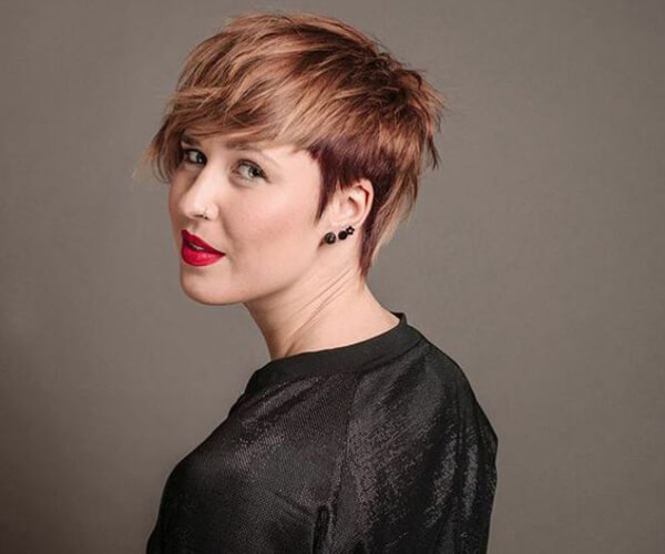 Women showing short brunette pixie haircut with red and blonde highlights