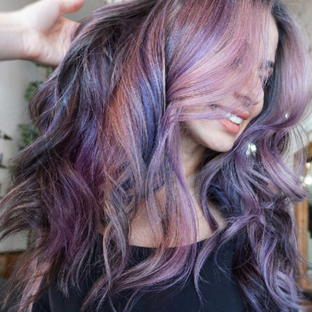 Model with purple hair highlights