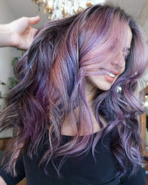 Model with purple hair highlights