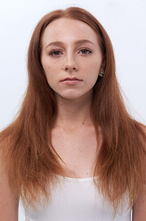 Model with red hair before haircut