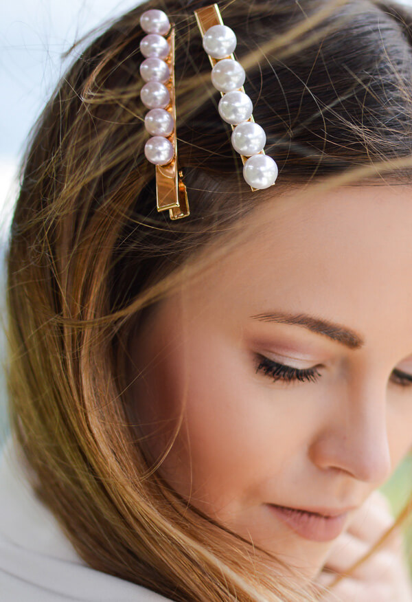 Woman with pearl barrettes in hair
