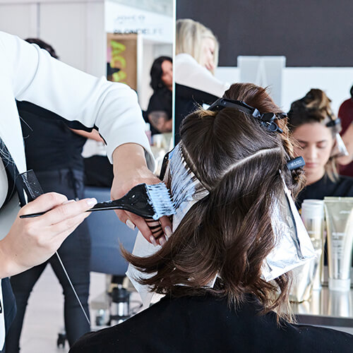 Women getting hair colored in salon