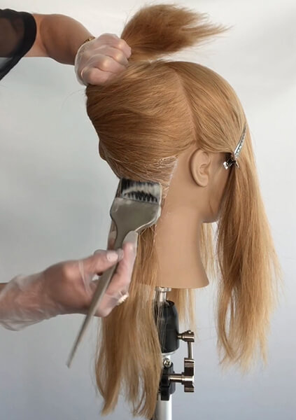 Mannequin head being colored professionally