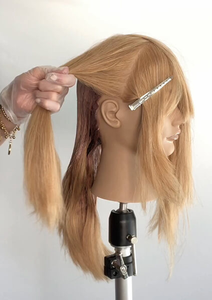 Mannequin head being colored professionally