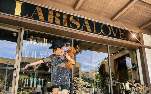Hairstylist Larisa Love outside Salon