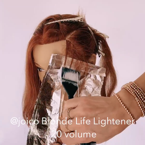 Mannequin head being colored with foils