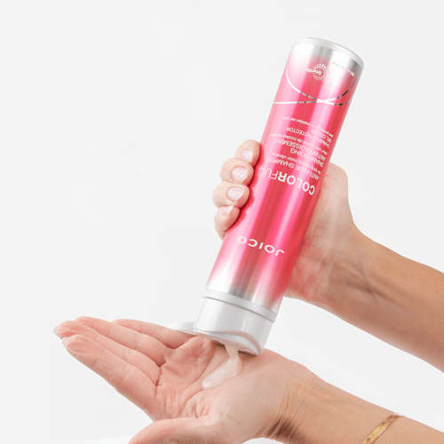 joico colorful-shampoo bottle squeezing into hand