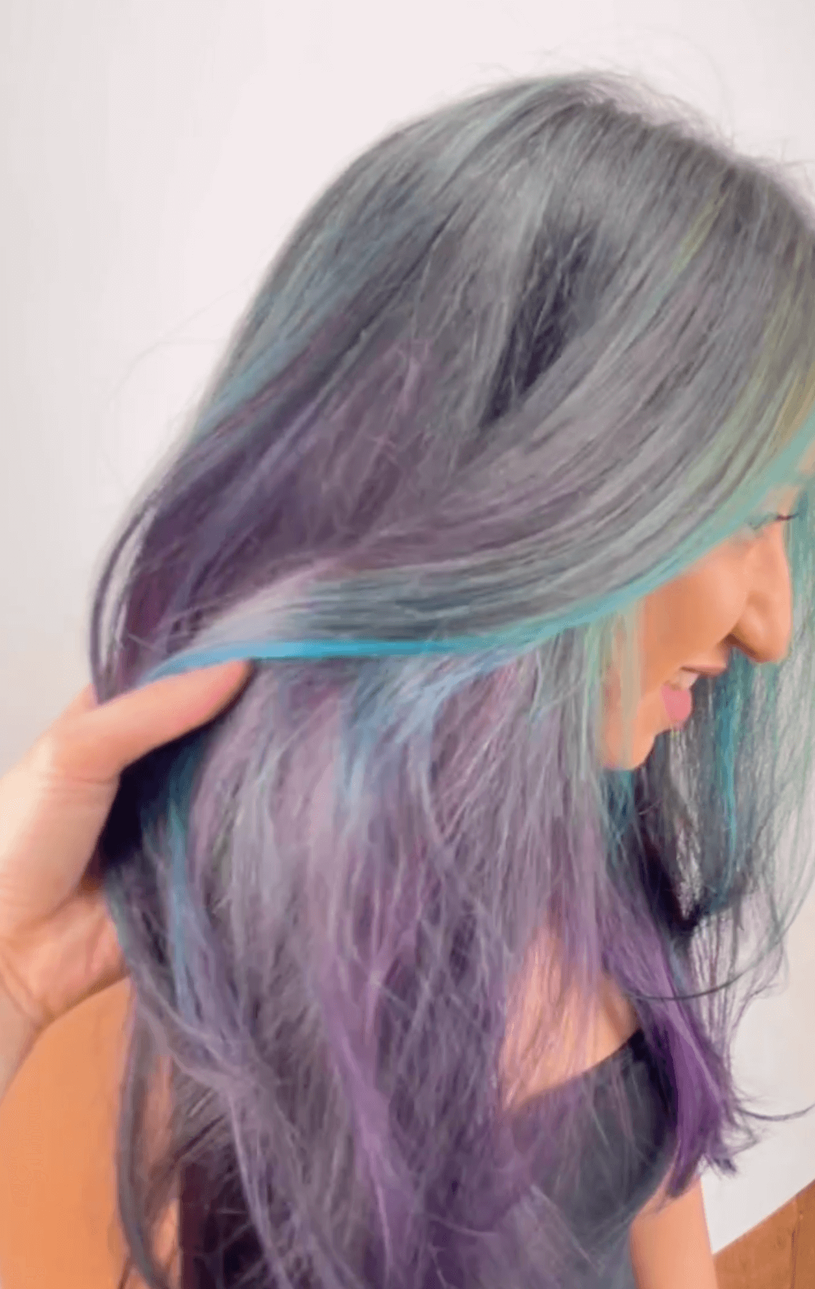 woman showing off grey, purple and blue hair