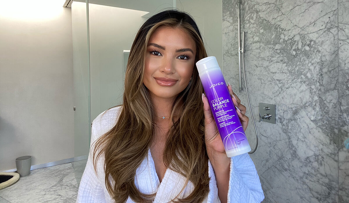 Woman Holding Color balance purple shampoo