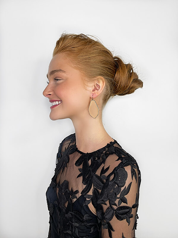 woman showing side view of hair in bun