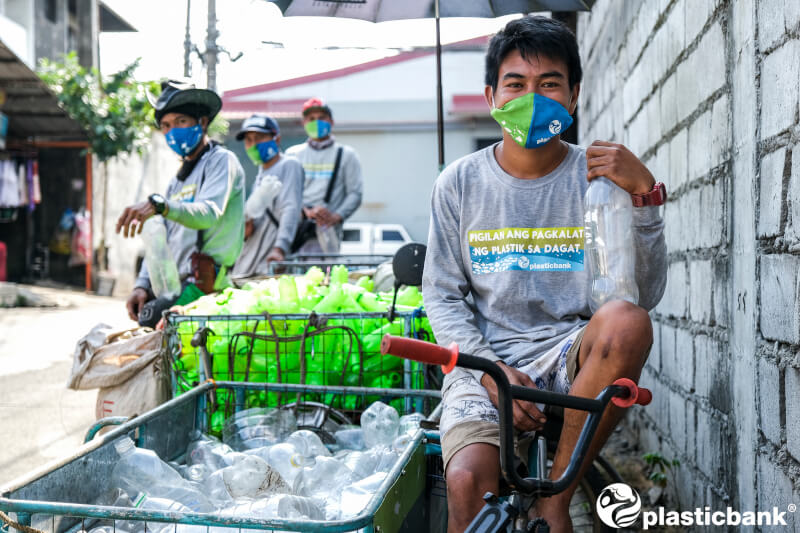man with bottles for plastic bank