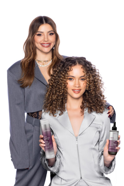 larisa with model holding defy damage shampoo and in a flash