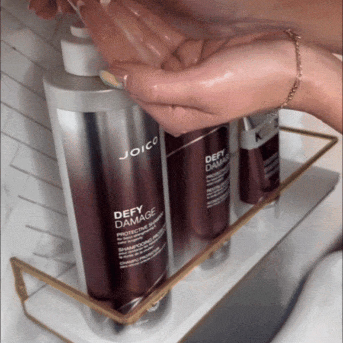 gif of olivia thompson and her bestie getting hair done with defy damage kbond20
